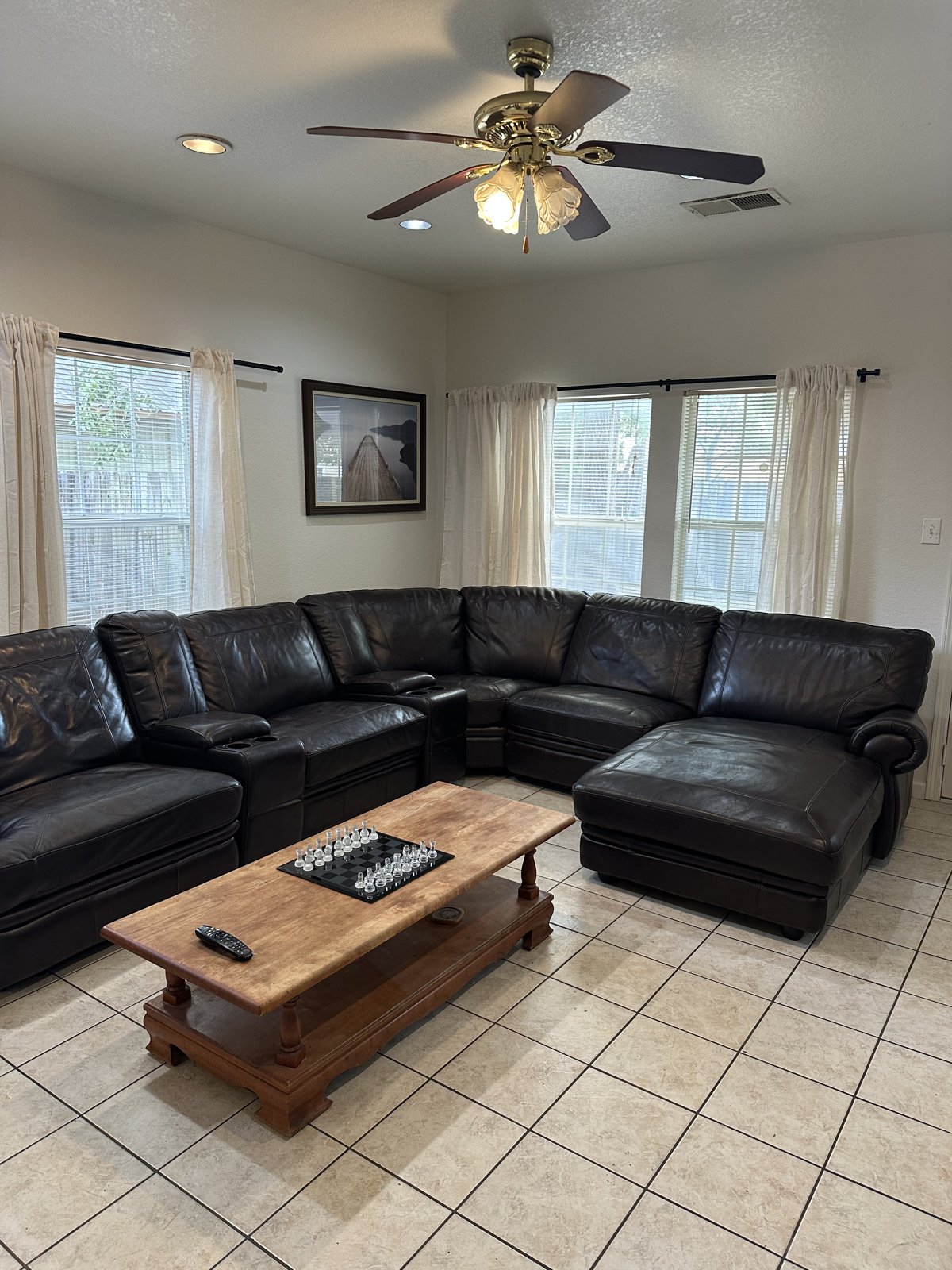 Main living room with a large leather sectional