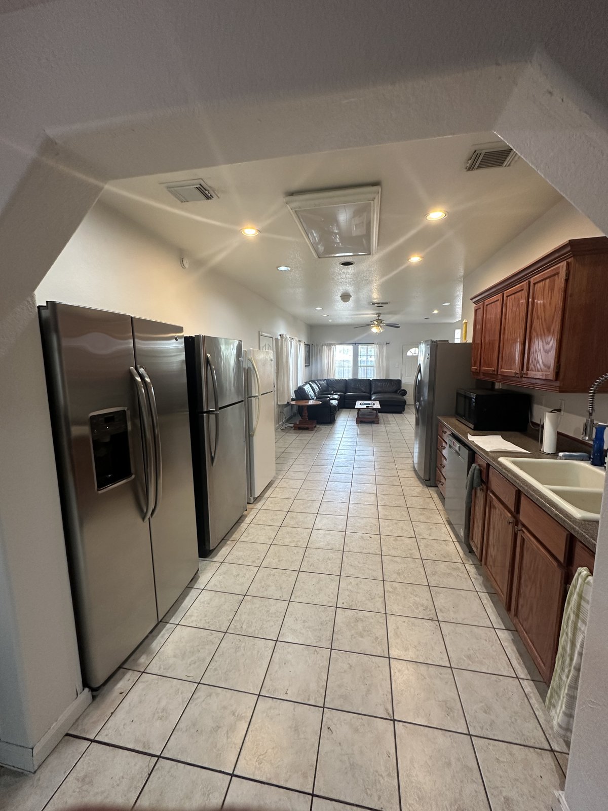 Large kitchen with four refrigerators